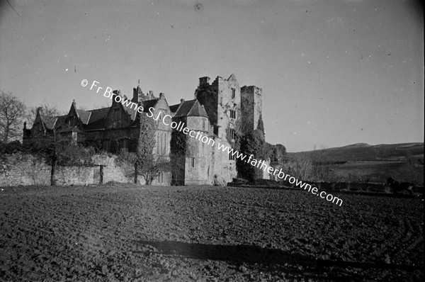 CARRICK CASTLE  VIEW FROM ORCHARD SHOWING OLD CASTLE AND ELIZABETHAN ADDITION